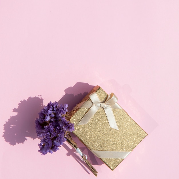 Free Photo | Copy space cute wrapped gift with flowers