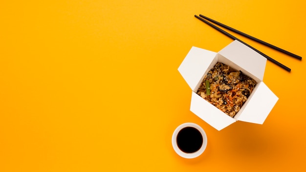 Download Free Photo Asian Food Box With Yellow Background PSD Mockup Templates