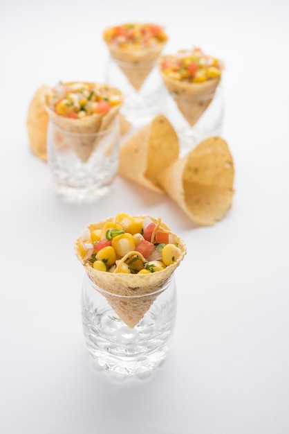 Premium Photo | Corn chat / chaat in papad cone, popular indian starter ...