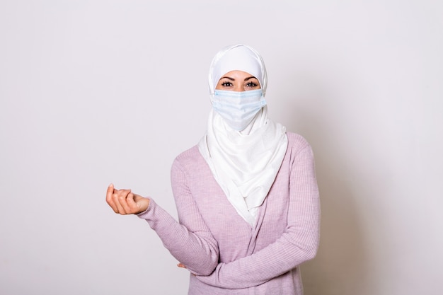 Download Premium Photo Corona Virus Pandemic Woman In Hijab With Medical Mask To Protect Her From Virus