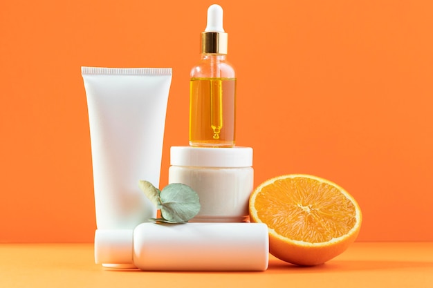 Premium Photo | Cosmetics on orange background