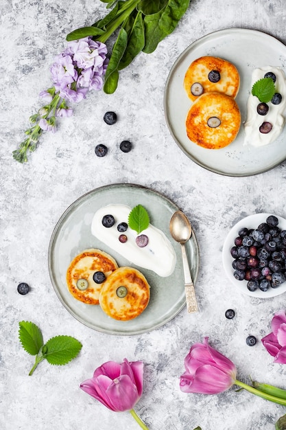 Premium Photo Cottage Cheese Pancakes With Blueberries Sour Cream And Mint