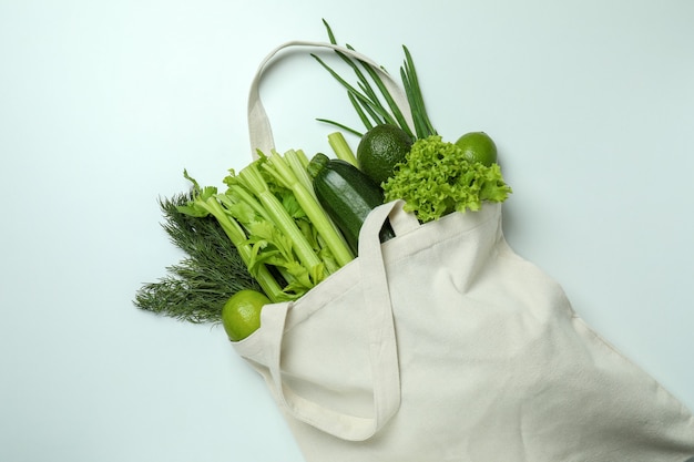 Premium Photo | Cotton bag with green vegetables on white background