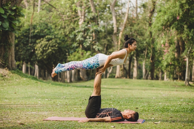 Free Photo | Couple of acrobats training in the nature