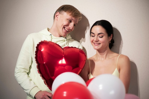 Free Photo Couple Celebrating Valentines Day With Balloons