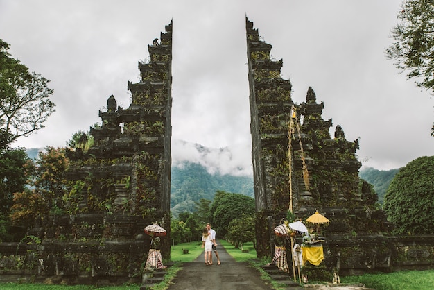 Premium Photo | Couple at handara gate, bali