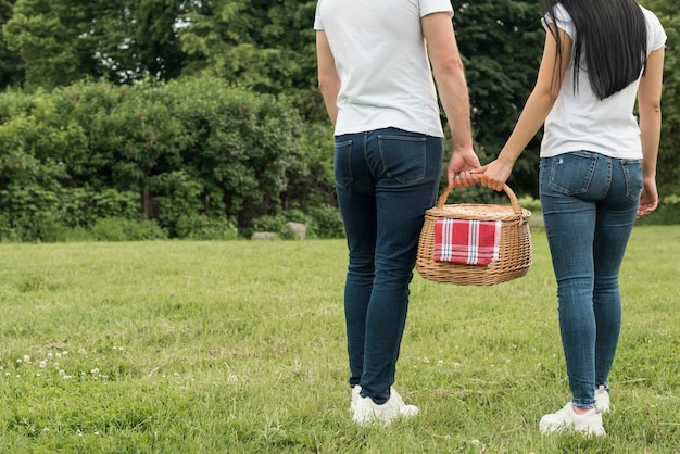 Free Photo | Couple holding a picnic basket