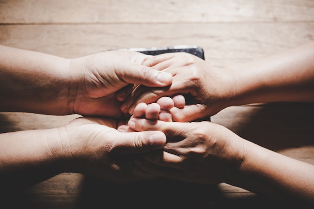 Free Photo | Couple of husband and wife are holding hands and pray