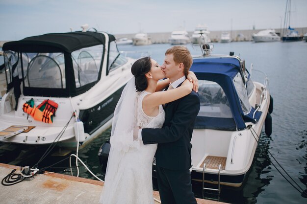 Free Photo | Couple kissing in the seaport