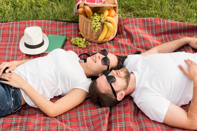Free Photo Couple Laying On A Picnic Blanket 0400