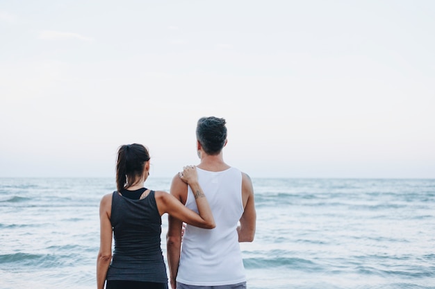 Premium Photo | Couple looking towards the horizon