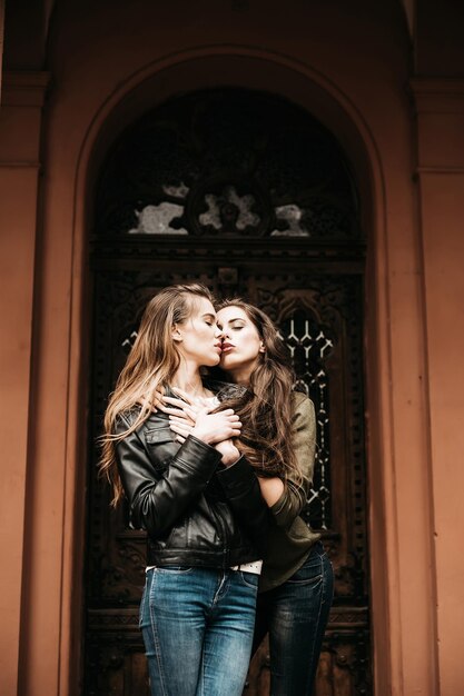 Premium Photo | Couple in love hugging and kissing in jeans outdoors