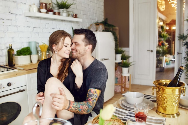 Premium Photo Couple In Love In The Kitchen In The Morning