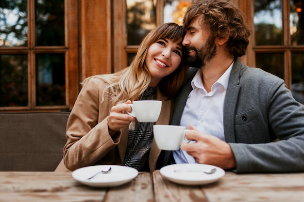 Free Photo | Couple in love sitting in a cafe, drinking coffee, having