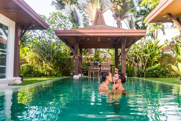 Premium Photo | Couple of lovers in a beautiful villa with swimming pool