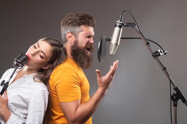 Premium Photo | Couple singing couple in recording studio music ...