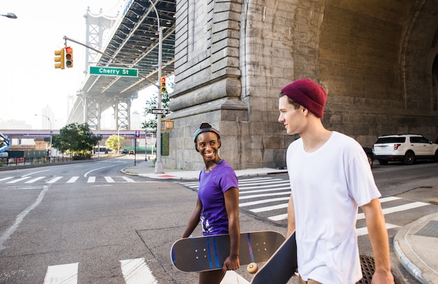 Premium Photo | Couple of skateboarders in new york