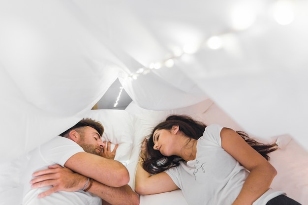 Couple Sleeping On Cozy Bed Photo Free Download