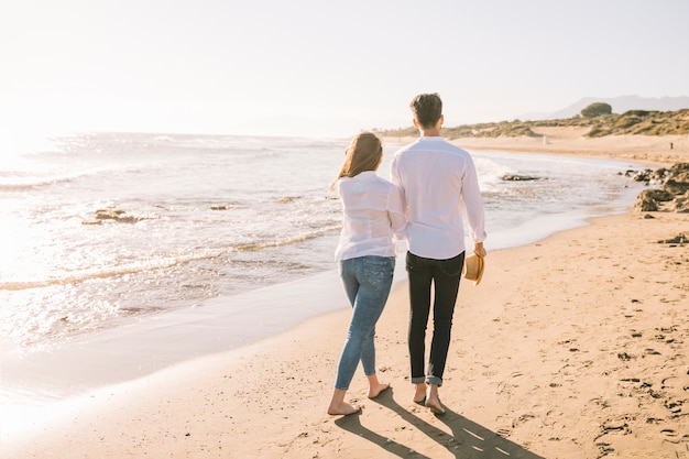 Free Photo | Couple walking on the beach
