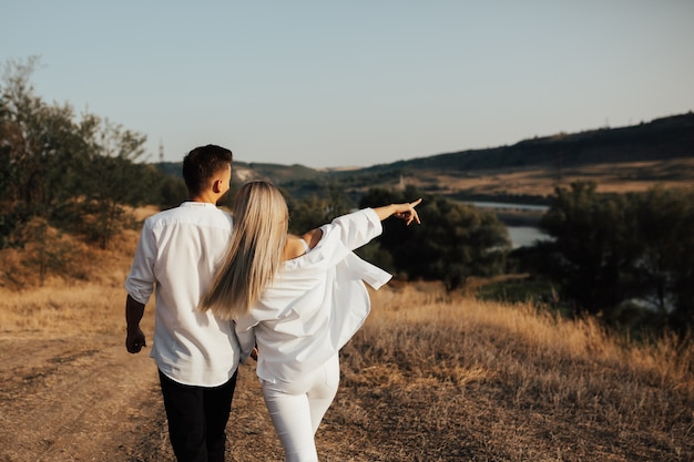 Premium Photo | Couple walking on the country road