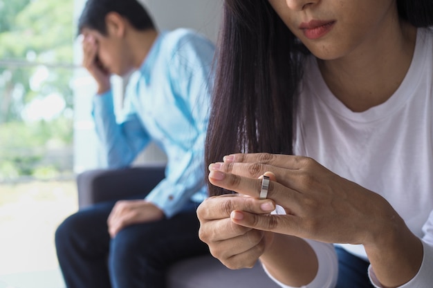 Couples have a relationship problem after quarreling, offended. the wife took the wedding ring and decided to quit and divorce. Premium Photo
