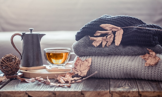 https://image.freepik.com/free-photo/cozy-autumn-still-life-with-a-cup-of-tea-and-decor-items-in-the-living-room-home-comfort-concept_169016-4579.jpg