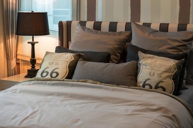 Cozy Bedroom Interior With Dark Brown Pillows And Reading