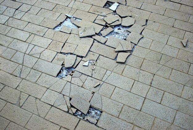 Premium Photo | Cracked floor tiles