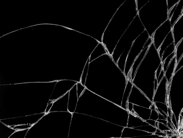 黒い背景にひびの入ったガラスの質感 プレミアム写真