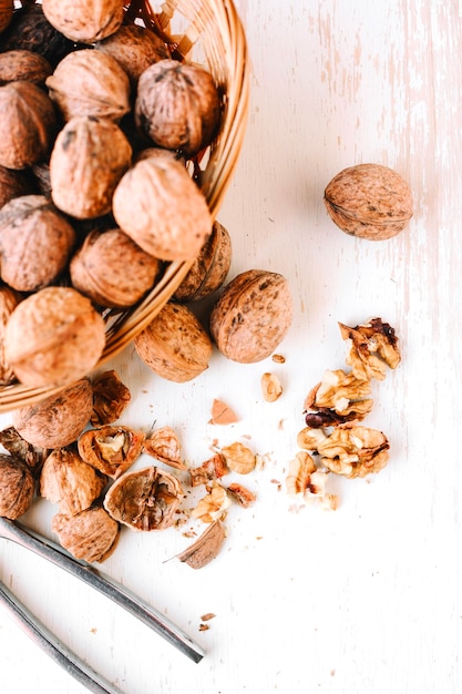 free-photo-cracked-walnuts-on-wooden-table