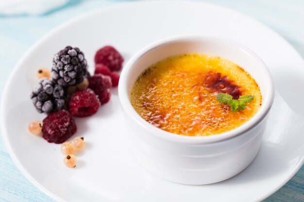 Premium Photo | Creme brulee on a white plate