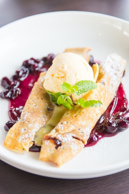 Free Photo | Crepes with raspberry jam and ice cream