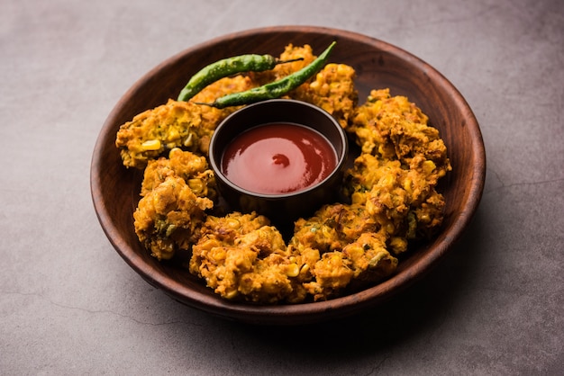 Premium Photo | Crispy corn pakora or pakoda, bhajji, bhaji, bajji or ...