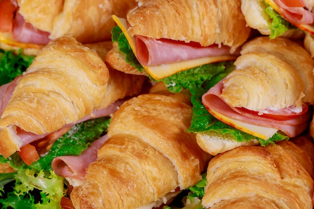 Premium Photo | Croissants sandwiches with lettuce , cheese , tomatoes ...