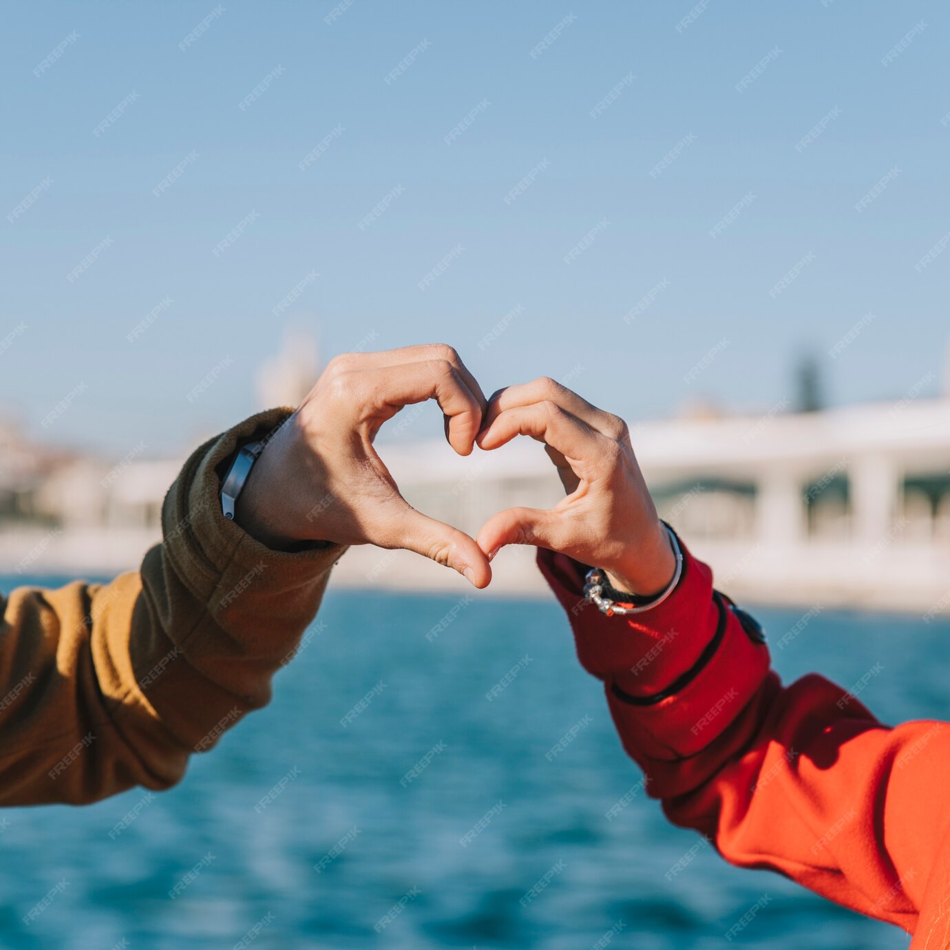 Free Photo | Crop couple showing heart with hands