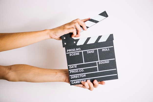 Crop hands with clapperboard | Free Photo