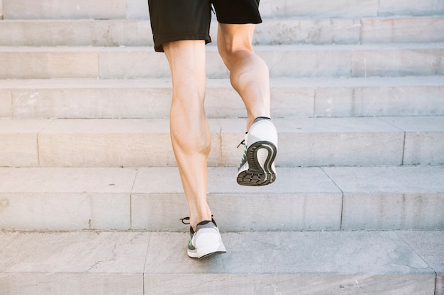 Free Photo | Crop legs running on cement steps