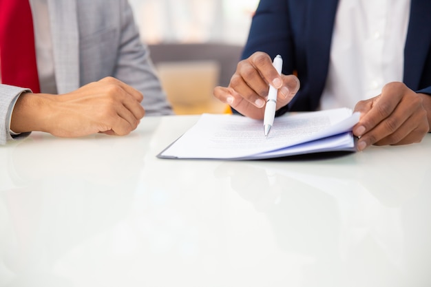 Free Photo | Cropped shot of business people reading contract