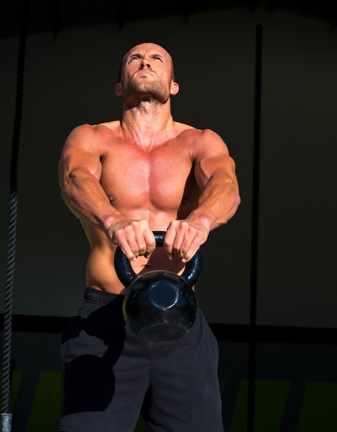 Crossfit Kettlebells Swing Exercise Man Workout Photo