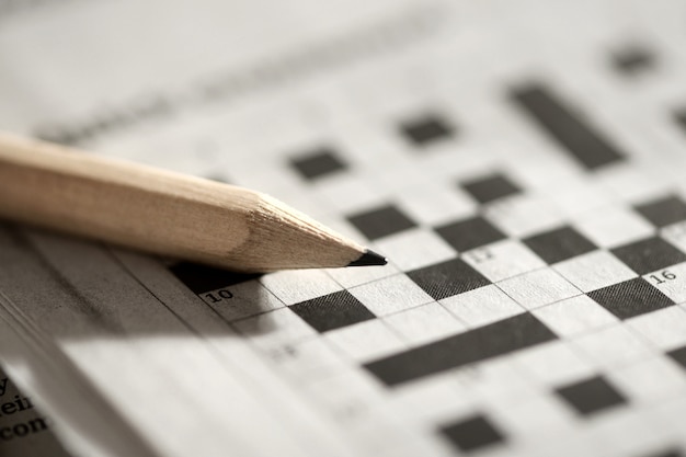 Premium Photo | Crossword puzzle and pencil