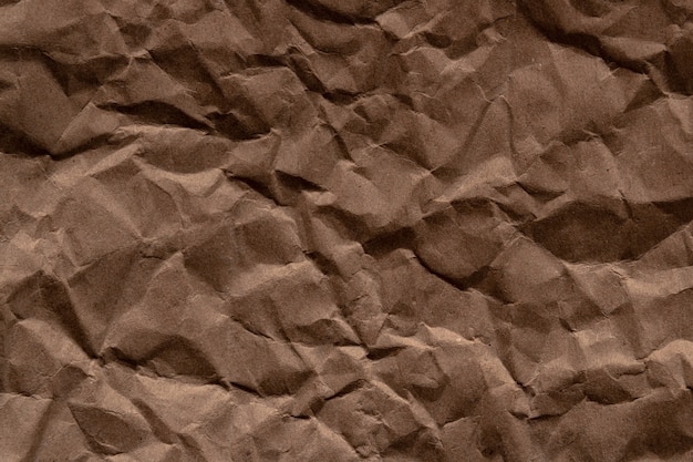 しわくちゃの紙 茶色の段ボール紙のシート 詳細な高解像度テクスチャ 壁紙の抽象的な背景 プレミアム写真