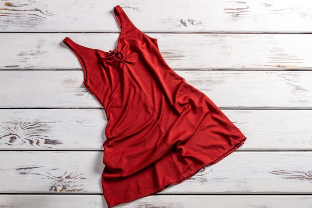 Premium Photo | Crumpled red dress. crumpled dress on wooden background ...