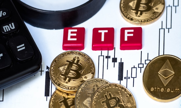 Crypto currency  bitcoin coin with etf text and magnifying glass placed on paper with a candlestick chart Premium Photo