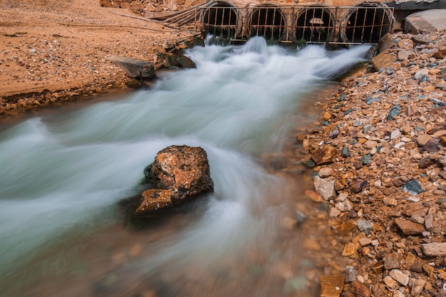 Premium Photo Culvert Flowing Steel Grating Industrial Water Slow