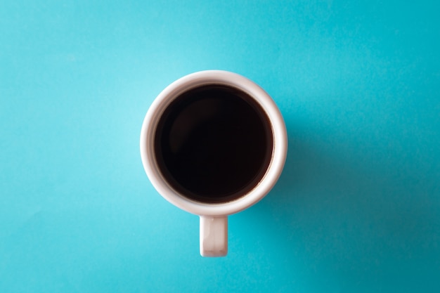 Premium Photo | Cup of coffee on blue background