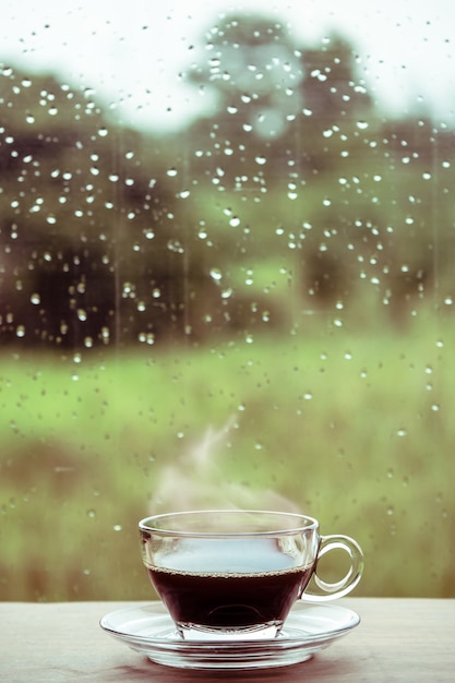 Premium Photo Cup Of Coffee On The Table Inside The Window Coffee Break In The Morning With Rainy Day