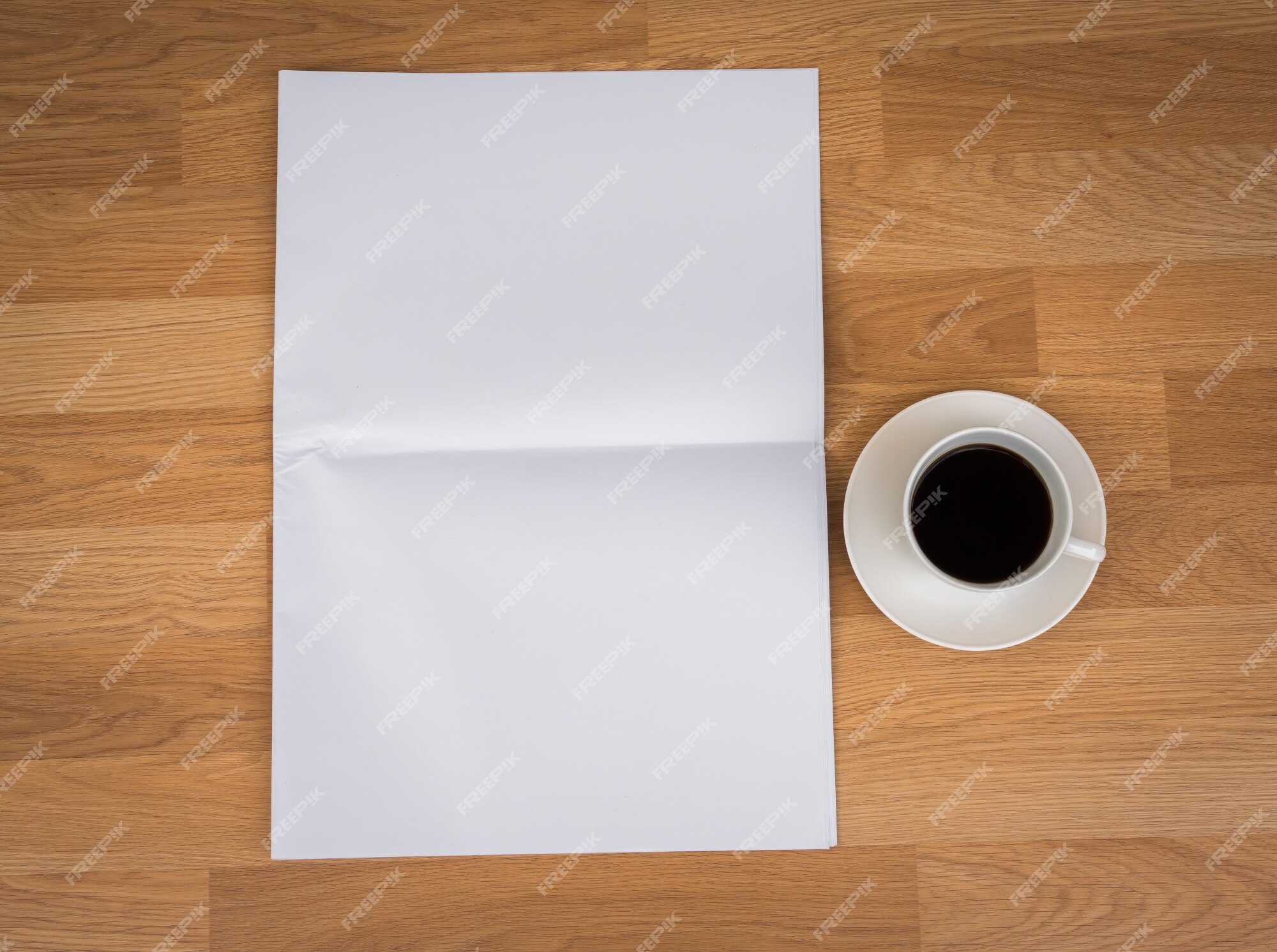 Free Photo | Cup of coffee with blank paper