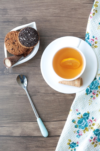 Free Photo | A cup of tea with cookies