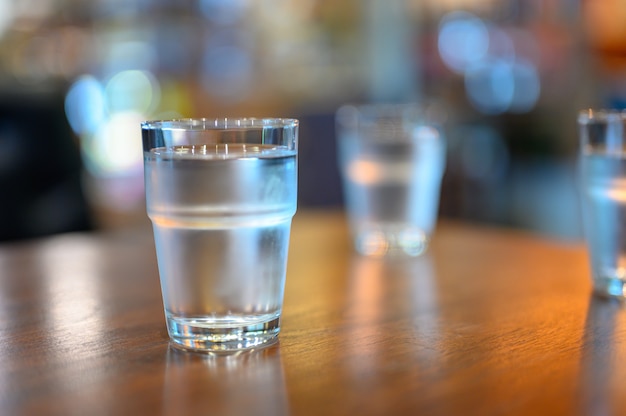 Premium Photo A Cup Of Water On Wooden Table Ready To Take Away For Drink