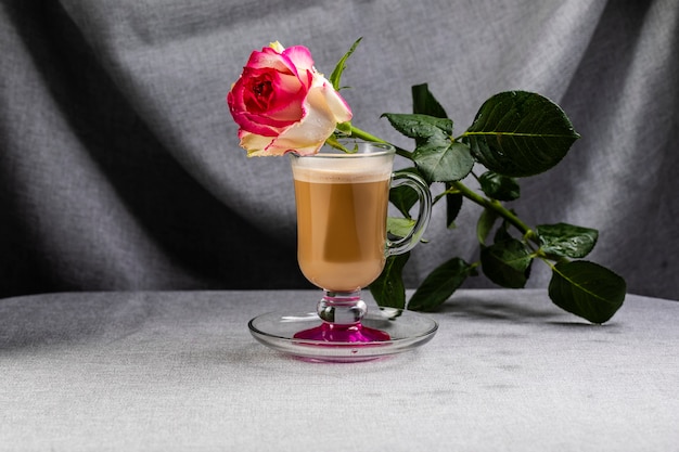 Premium Photo On A Cup With A Coffee Drink Is A Rose With Water Droplets On The Petals